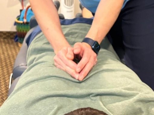 Chiropractor adjusting a patient during a chiropractic session