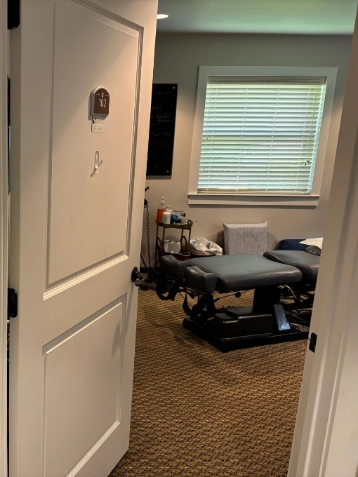 Dr. Fawn Ray providing personalized chiropractic care during a patient visit at her Colleyville chiropractic clinic.