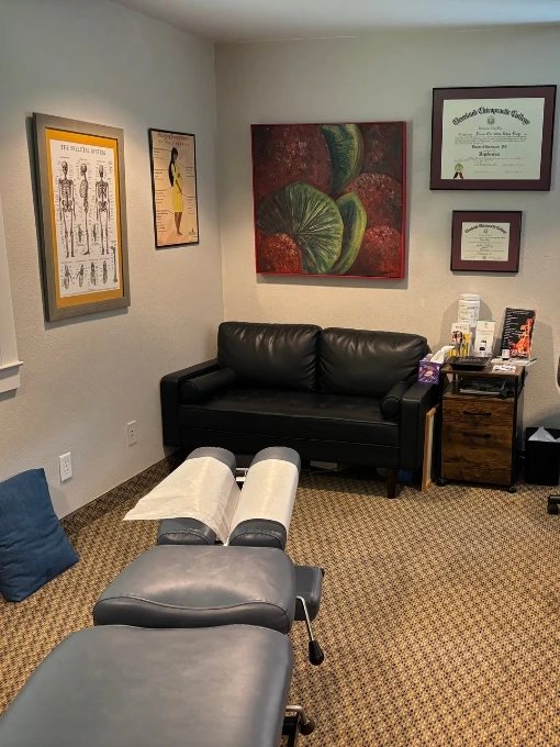 Interior of Dr. Fawn Ray’s chiropractic treatment room with equipment and adjustment table