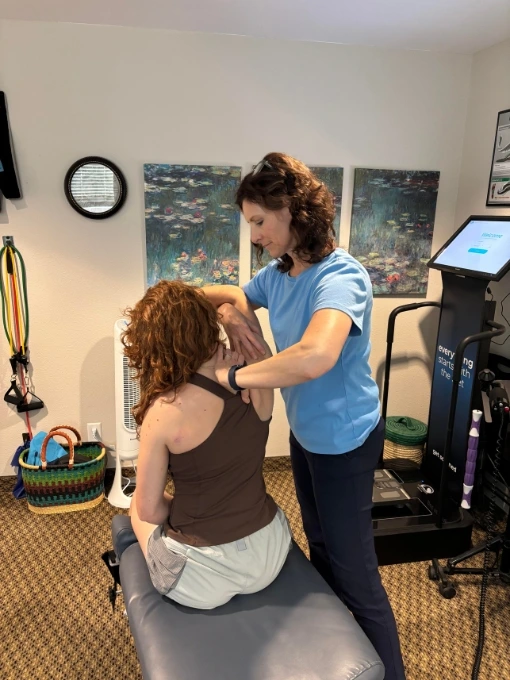 Chiropractor Dr. Fawn Ray providing personalized soft tissue therapy for shoulder pain relief